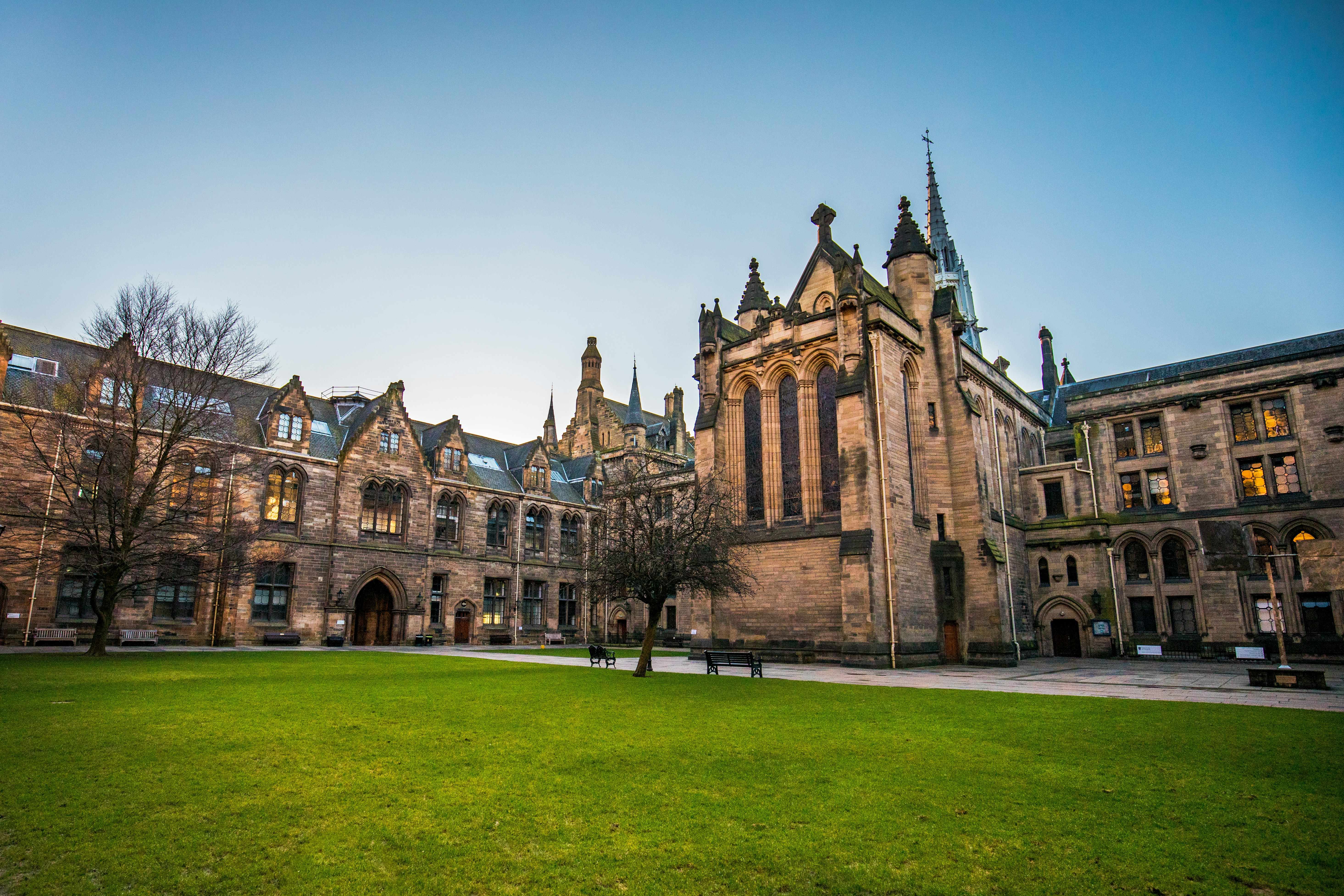 University campus with historic buildings and a green courtyard
